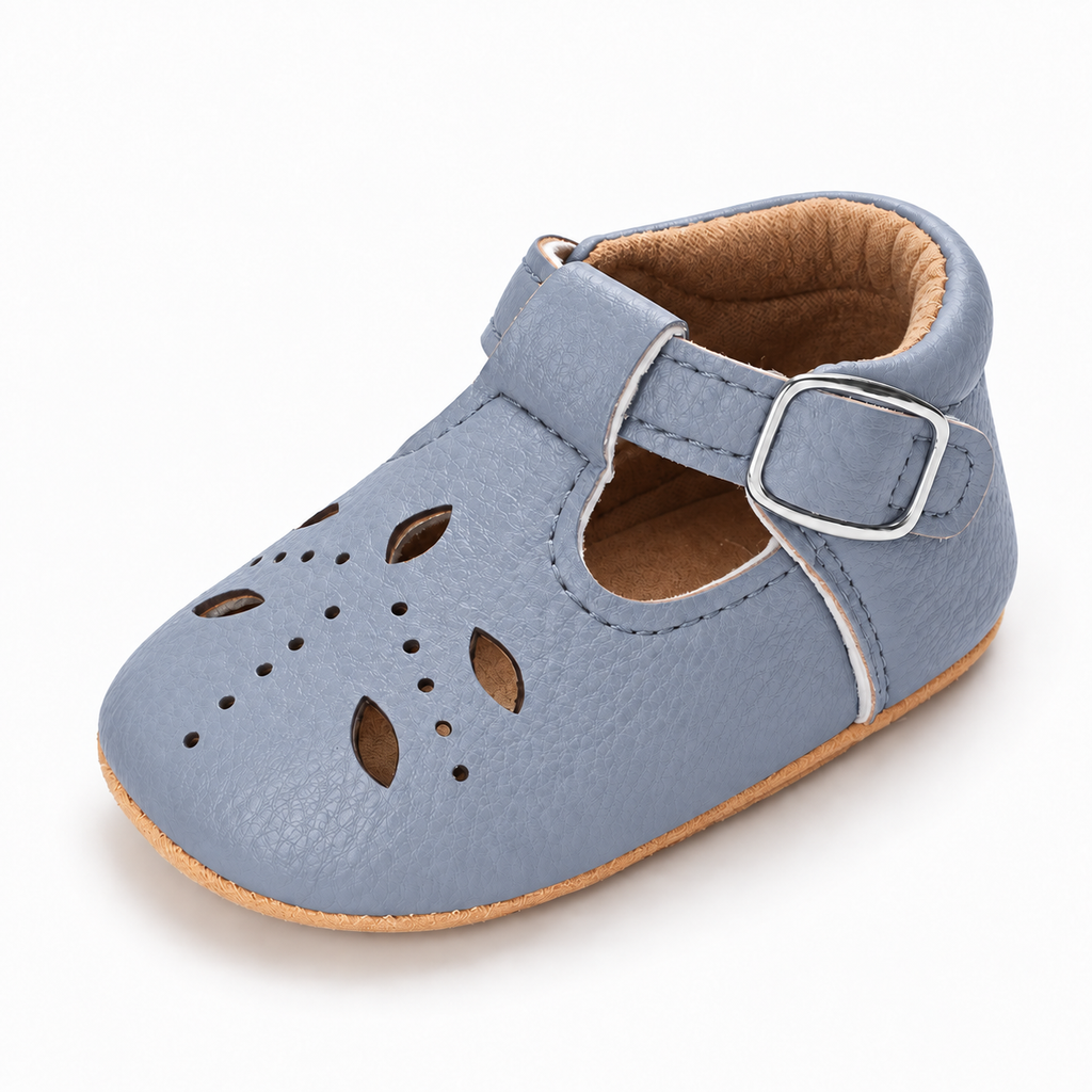 Baby Cut Out Mary Jane Shoes Blue variant image - Blue baby cut out Mary Jane shoes with rounded toe, perforated upper, buckle strap and flexible tan sole.