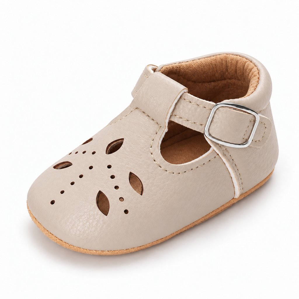 Baby Cut Out Mary Jane Shoes Cream variant image - Cream baby cut out Mary Jane shoes with cut out leather details, silver buckle and soft tan baby sole.