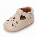 Baby Cut Out Mary Jane Shoes Cream variant image - Cream baby cut out Mary Jane shoes with cut out leather details, silver buckle and soft tan baby sole.