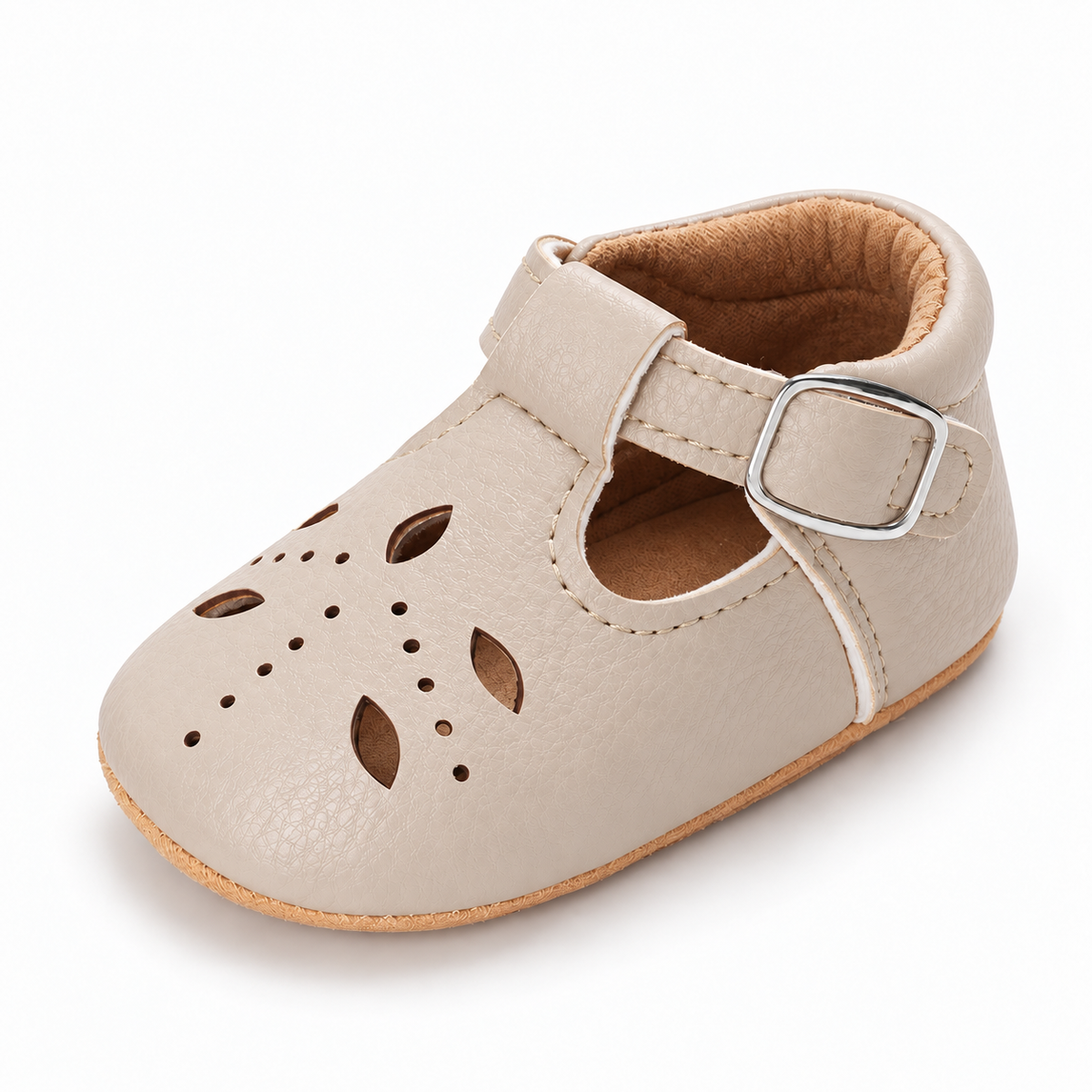 Baby Cut Out Mary Jane Shoes Cream variant image - Cream baby cut out Mary Jane shoes with cut out leather details, silver buckle and soft tan baby sole.