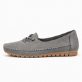 Grey womens soft round toe comfort loafers, side profile with flexible tan sole and cushioned everyday design