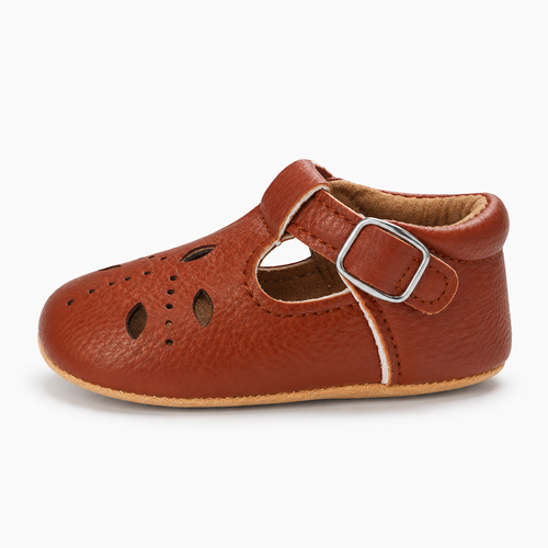 Baby Cut Out Mary Jane Shoes Brown side view - Side profile of Brown baby cut out Mary Jane shoes showing rounded toe, buckle strap and soft flexible sole.