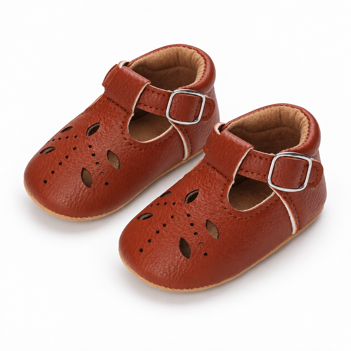 Baby Cut Out Mary Jane Shoes Brown pair view - Pair of Brown baby cut out Mary Jane shoes with decorative perforations, silver buckle and premium baby footwear finish.