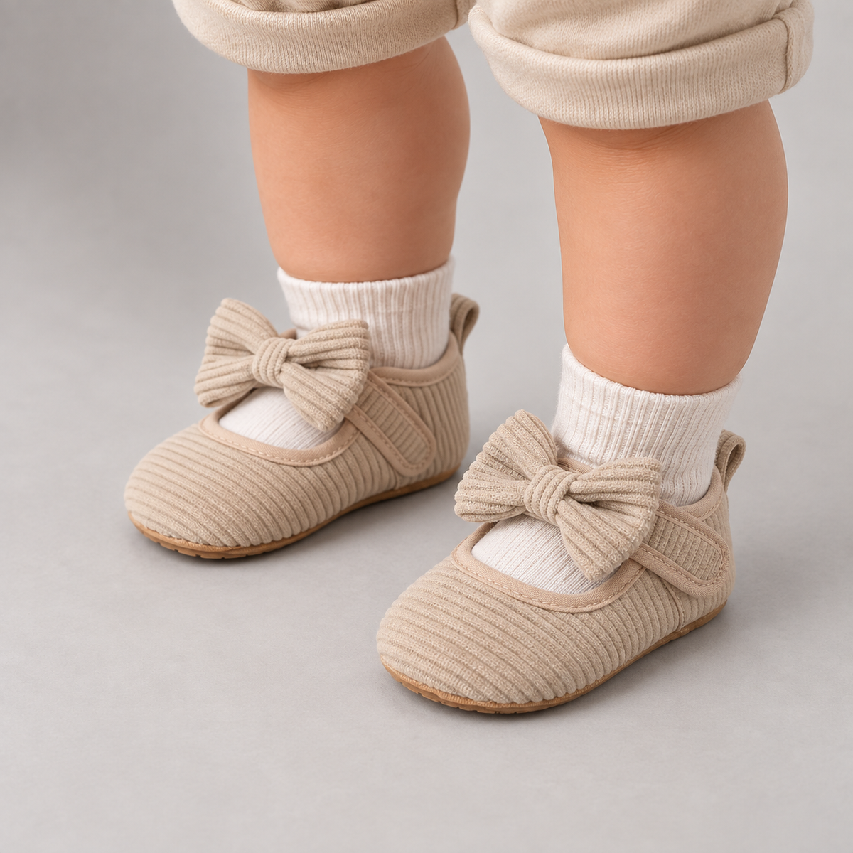 Baby boy wearing Beige Baby Bow Corduroy Mary Jane Shoes with soft first walker sole