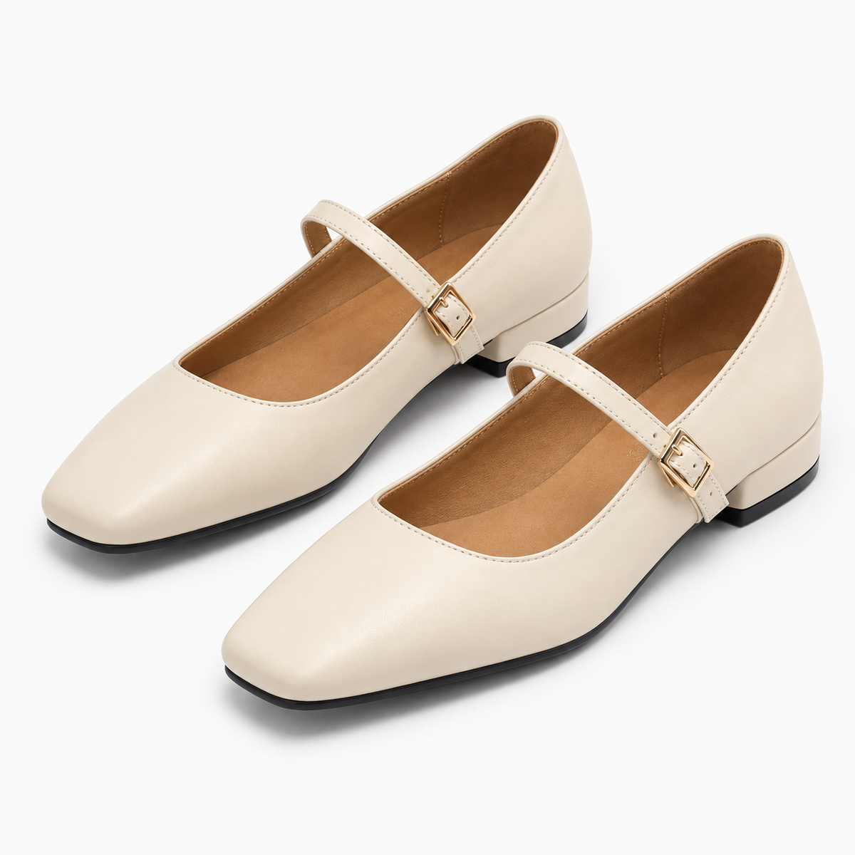 Beige square toe ballet flats - angled pair view. Premium angled pair image of beige square toe Mary Jane ballet flats with gold buckle, soft beige upper and elegant flat profile.