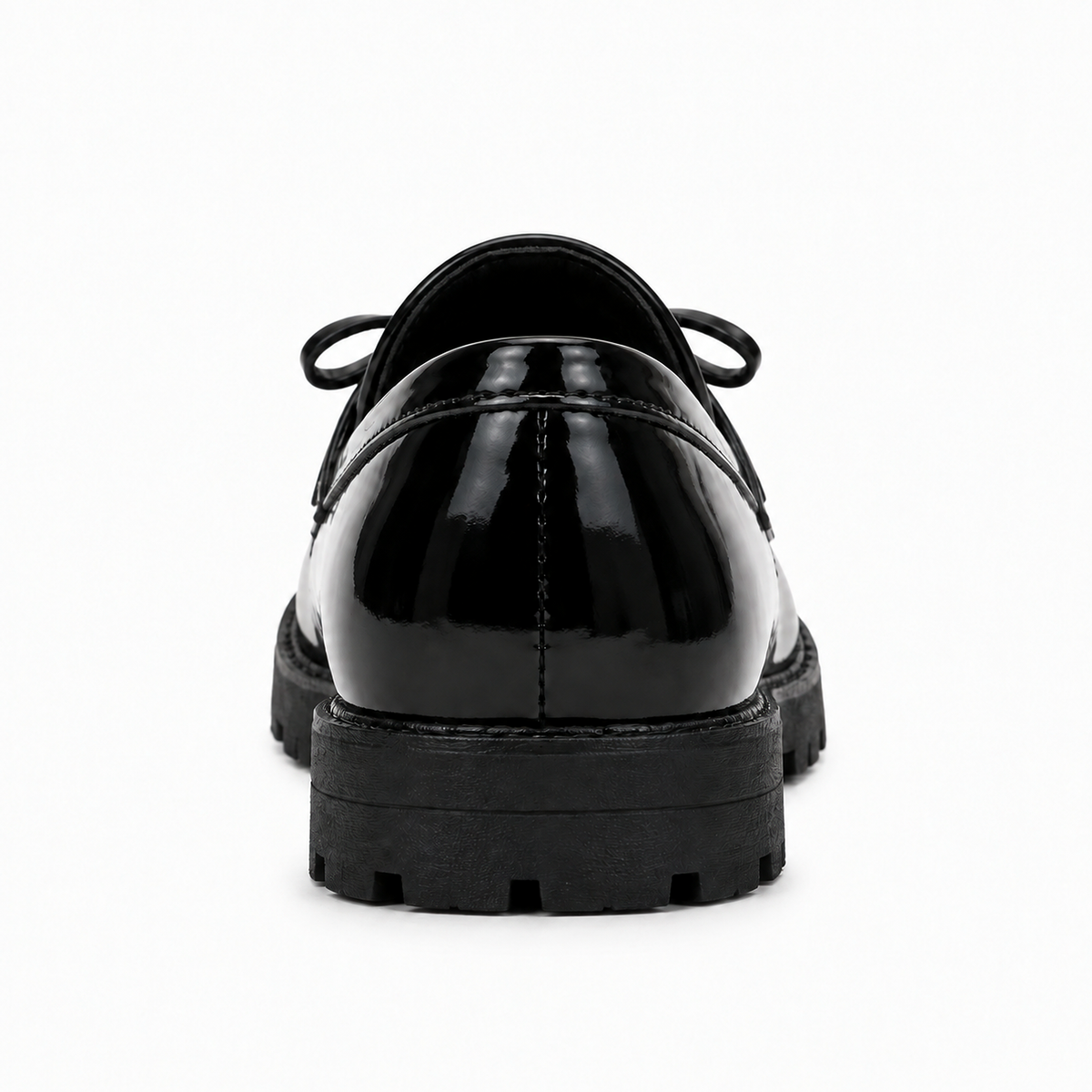 Kids Tassel Bow Loafers Black - rear view bow detail. Rear studio view of black glossy kids tassel bow loafers showing the heel, lug sole and subtle bow detail for a premium product gallery.