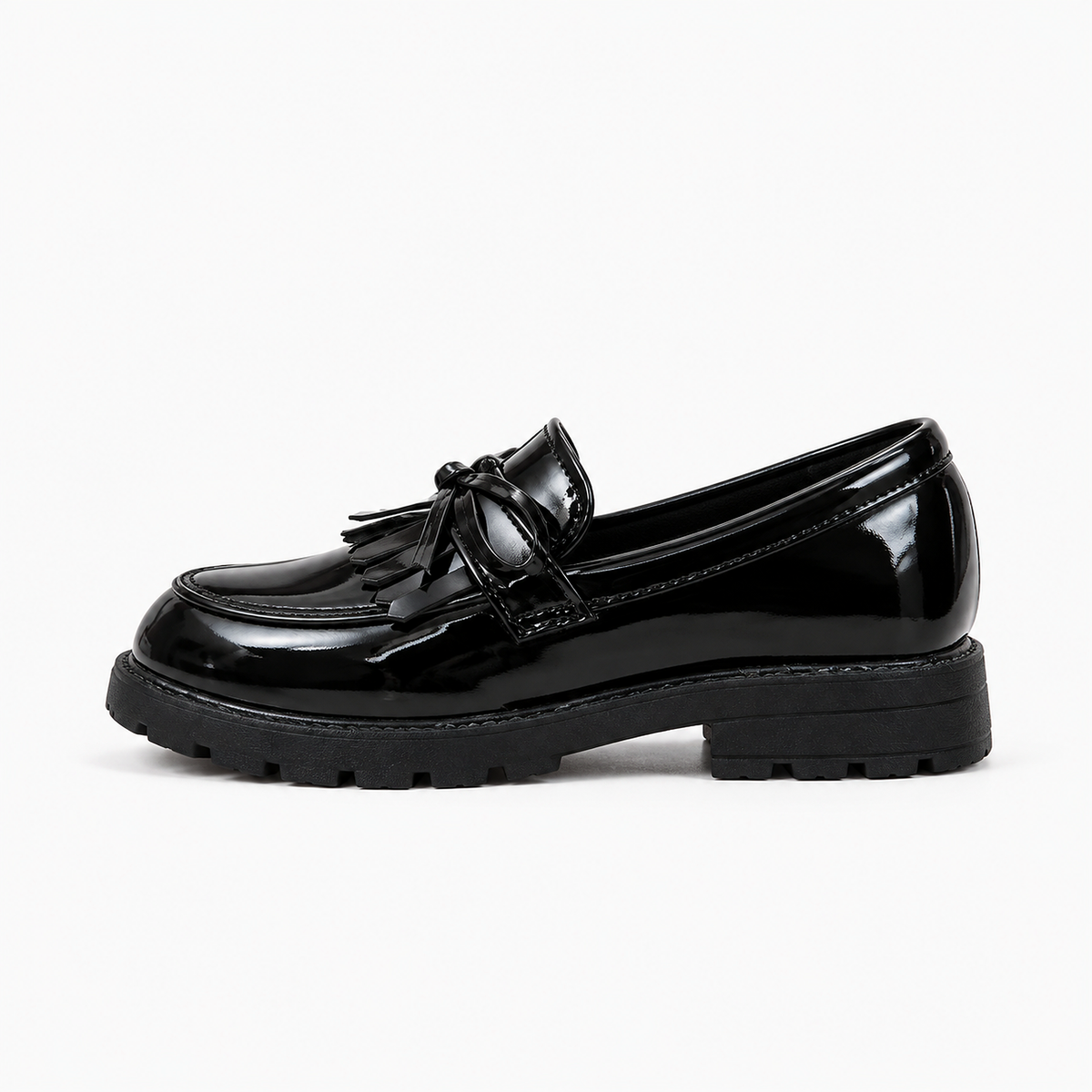 Kids Tassel Bow Loafers Black - side profile product photo. Premium side profile studio image of black glossy kids tassel bow loafers with chunky lug sole and polished patent finish.