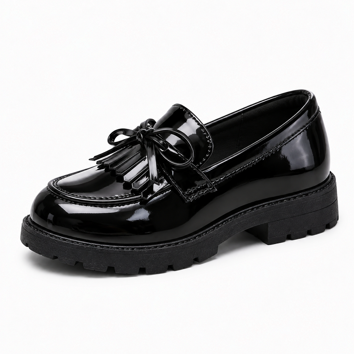 Kids Tassel Bow Loafers Black - single side view. Single side studio photo of black glossy kids tassel bow loafers with neat tassel detail, stitched apron and chunky lug sole.