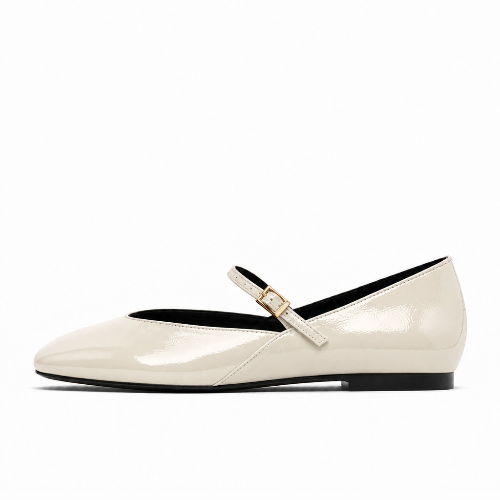 Beige womens patent round toe ballet flats side view with Mary Jane strap and gold buckle