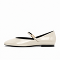 Beige womens patent round toe ballet flats side view with Mary Jane strap and gold buckle