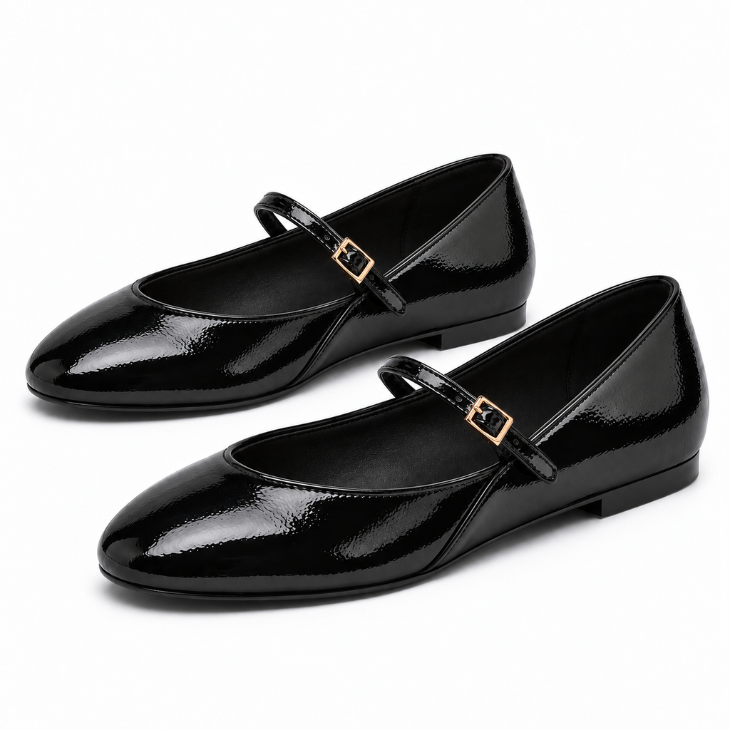 Pair of black womens patent round toe ballet flats with Mary Jane straps and gold buckles