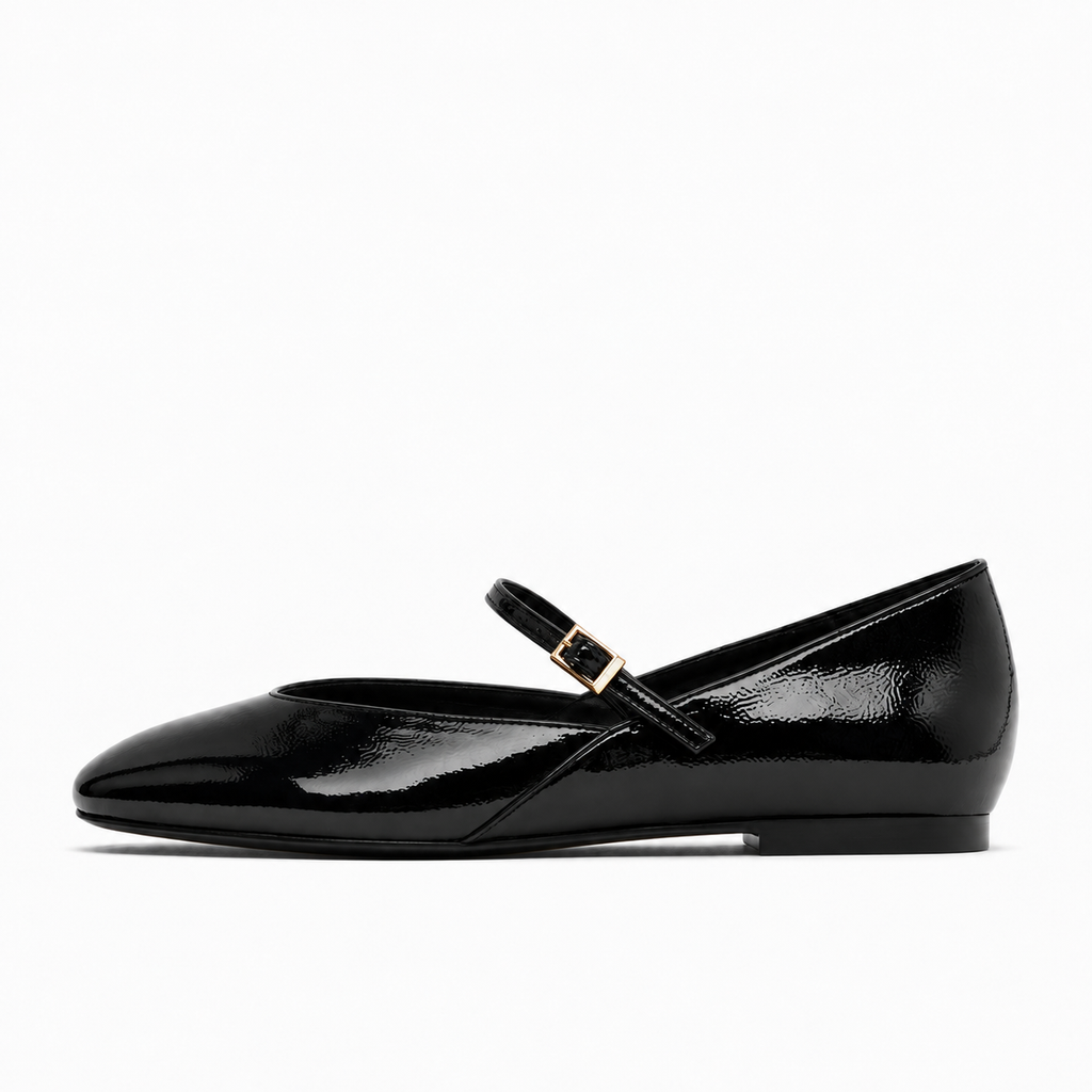 Black womens patent round toe ballet flats side view with glossy Mary Jane strap and gold buckle
