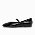 Black womens patent round toe ballet flats side view with glossy Mary Jane strap and gold buckle
