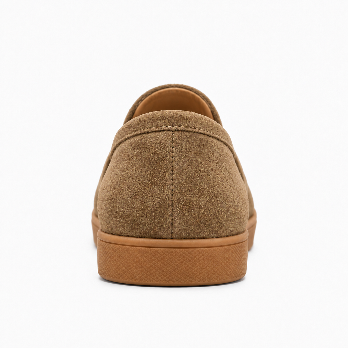 Womens suede tassel loafers rear view with structured heel and gum sole